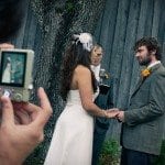 Bride and groom hold hands at alter during wedding ceremony in Nashville Tennessee