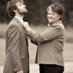 Mother pins flower to groom at wedding ceremony in Nashville Tennessee