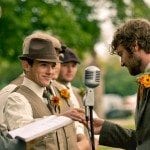 Groom takes ring from groomsmen at alter during wedding ceremony in Nashville Tennessee