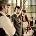 Groomsmen gives speech as bride and groom watch at wedding in Nashville Tennessee