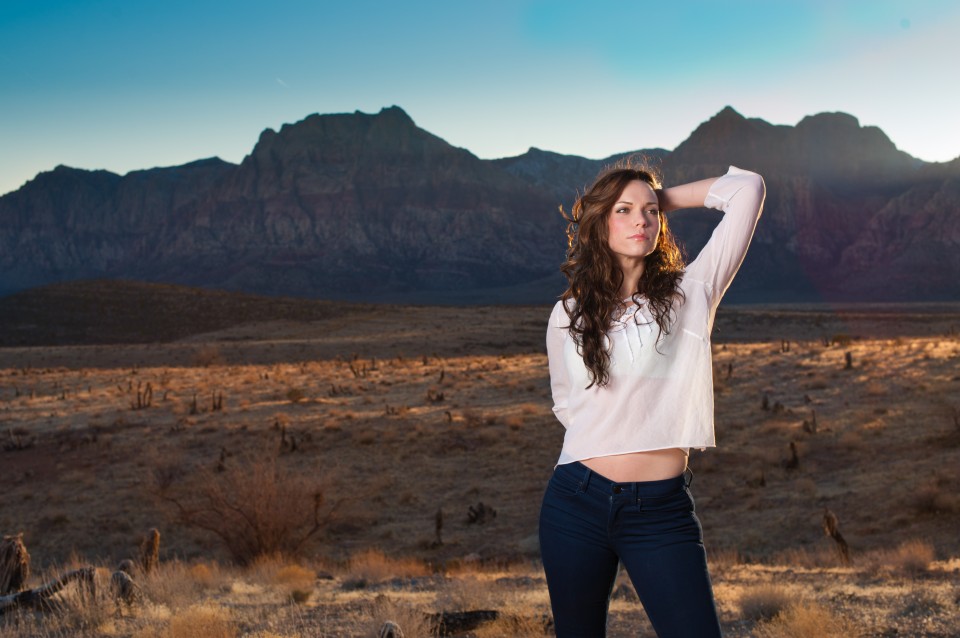 beautiful portrait of brunette model girl with mountains of nevada in the background
