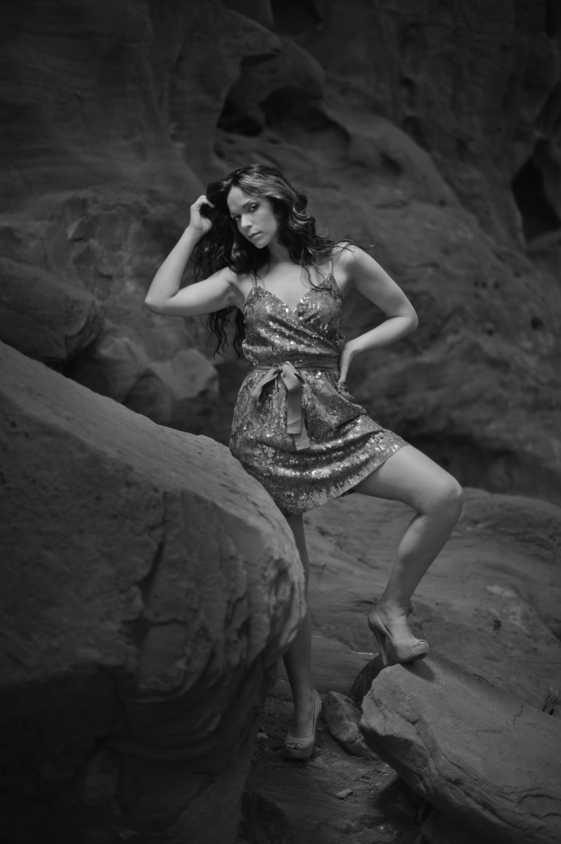 Black and White portrait of beautiful model standing near rocks in nevada by don wright