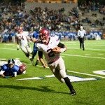 MBA football player runs the ball down the field in Tennessee