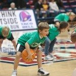 Children practice skills on the court with basketball in Tennessee