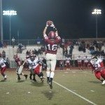 MBA football player leaps in the air to catch a pass in Tennessee