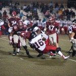 MBA football player makes a run and is tackled by the defense in Tennessee