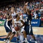 Belmont basketball player fights the defense for a shot in Tennessee