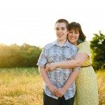 mother and son hug standing in a sunny field in Tennessee