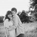 son hugs mom outside in field in Tennessee