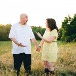 couple in funny moment talking outside in a sunny field in Tennessee