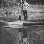 two smiling girls reflected in lake in Tennessee