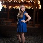 smiling girl in cowboy boots and blue dress outside in Tennessee