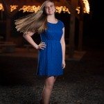 smiling girl in blue dress whipping hair in Tennessee