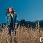 Young girl wearing denim in sunny field in Tennessee