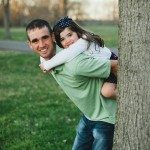 father gives daughter a piggy back ride outside in Tennessee