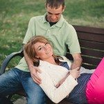 husband looks at wife on bench outside in Tennessee