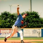Pitcher stands on mound and makes a pitch in Tennessee