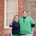 Couple in front of old brick house in Murfreesboro Tennessee