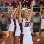 Cheerleader in stance during football game in Tennessee