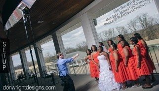 photographer has lighting setup for bridal portrait of girls